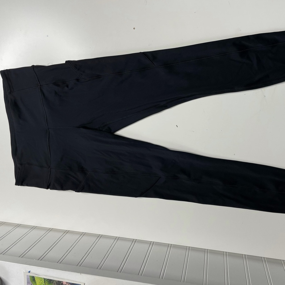 Black lululemon leggings, size 4, side pockets, perfect condition never worn
